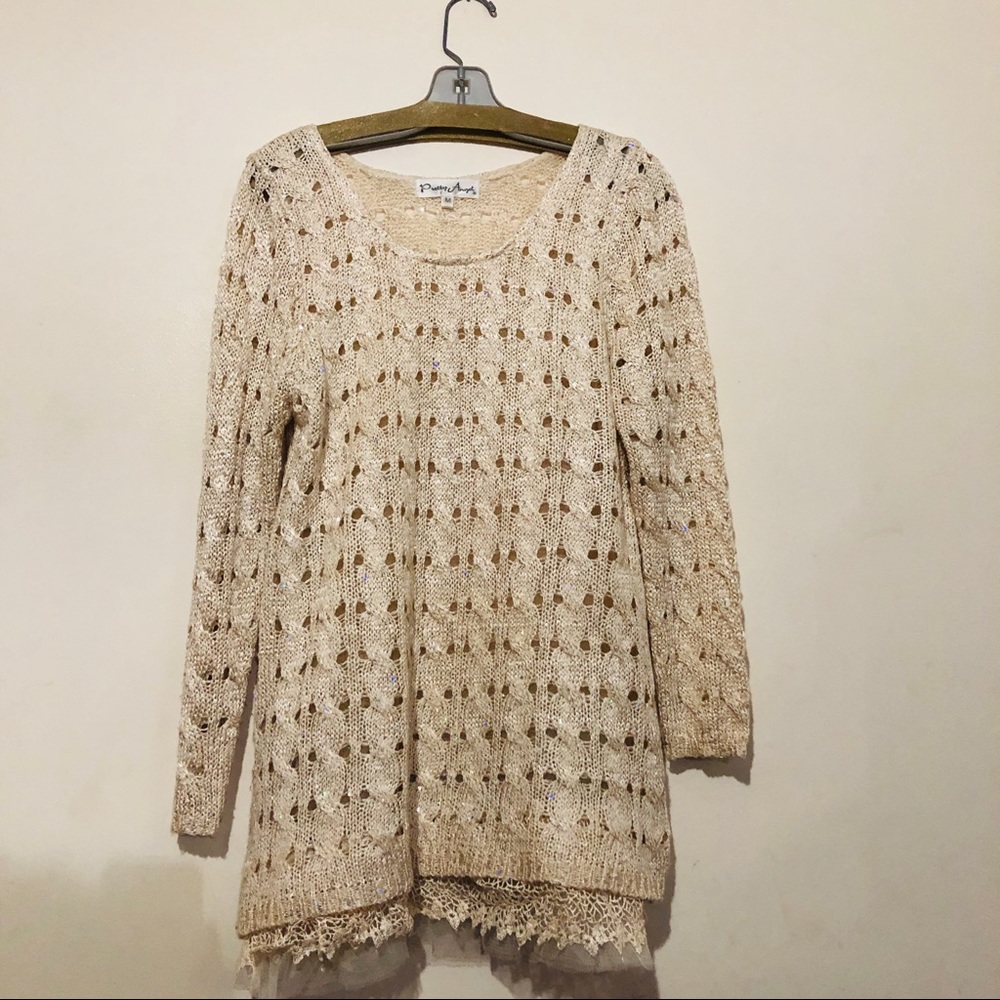 Sweater with sequins and ruffles